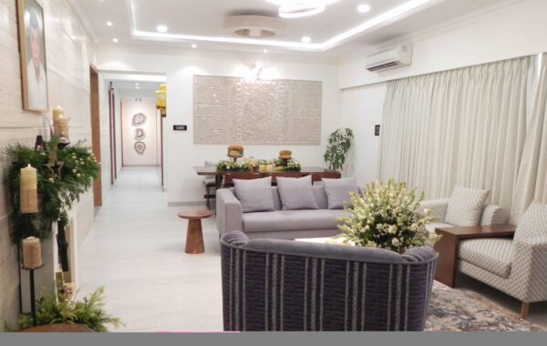 Contemporary living room with sectional sofa and modern wall art in apartment