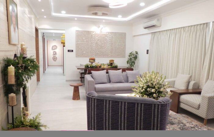 Contemporary living room with sectional sofa and modern wall art in apartment