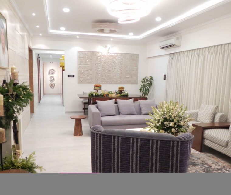 Contemporary living room with sectional sofa and modern wall art in apartment