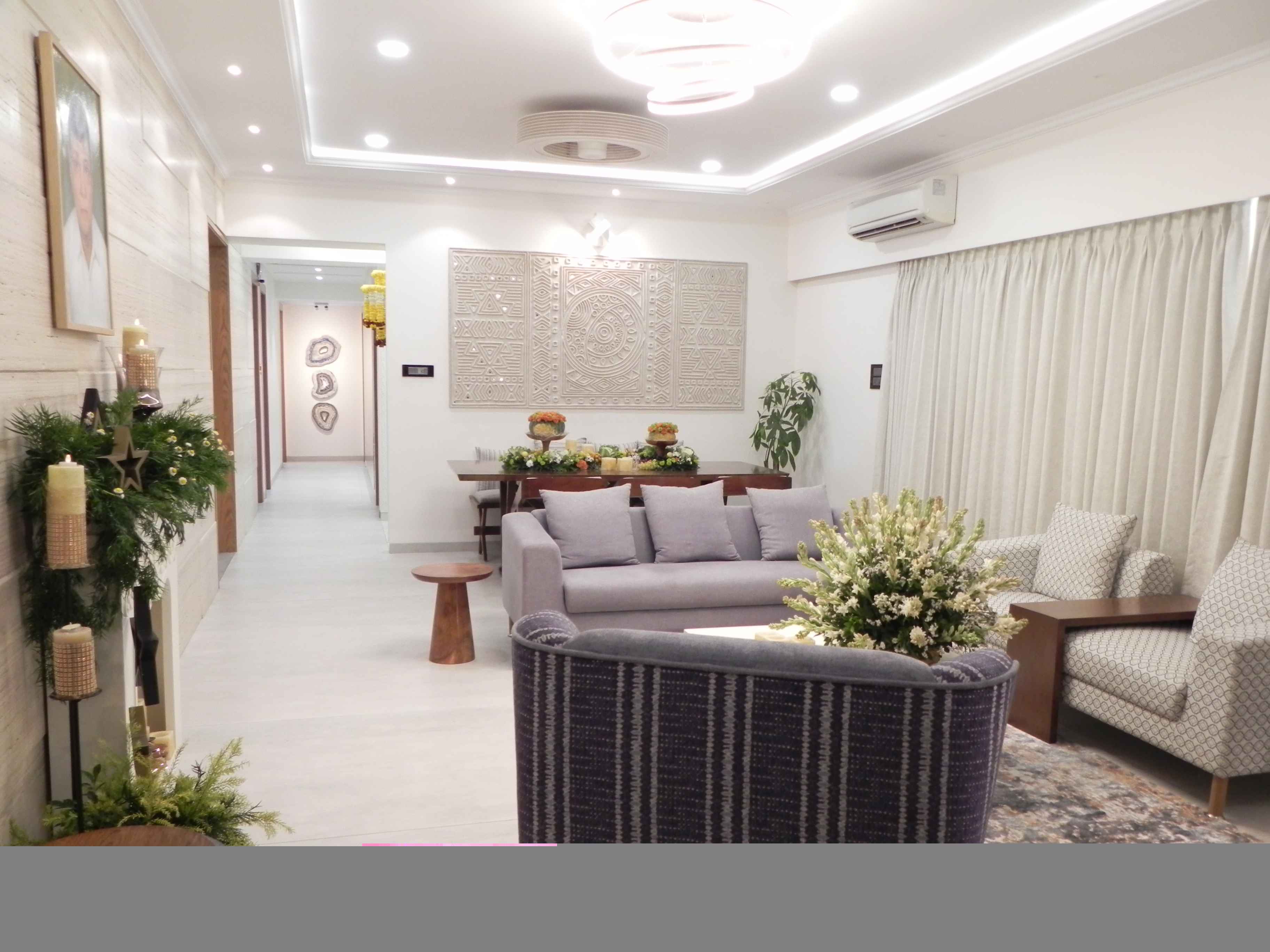 Contemporary living room with sectional sofa and modern wall art in apartment