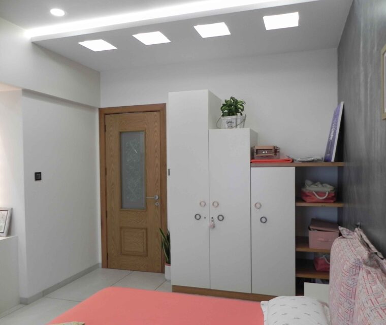 Modern bedroom interior design with stylish wardrobe and wooden door