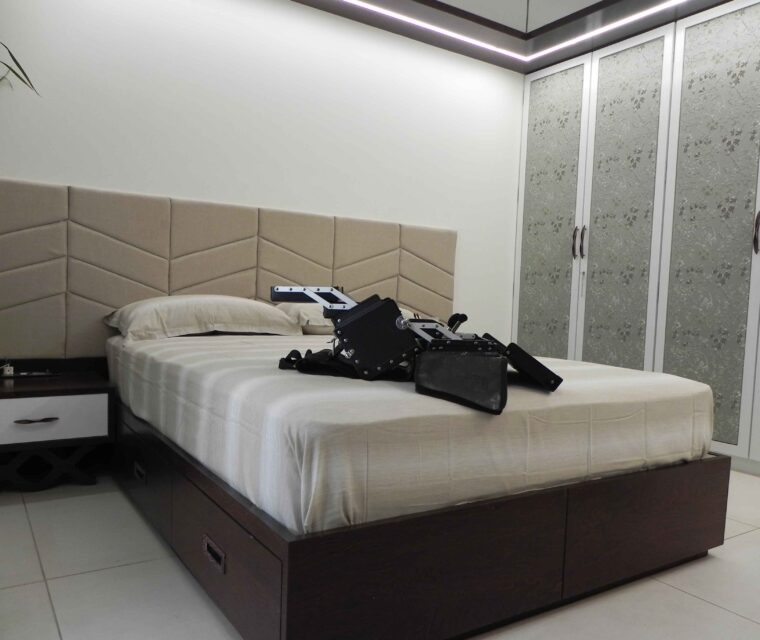 Luxury bedroom with upholstered headboard and custom wardrobes