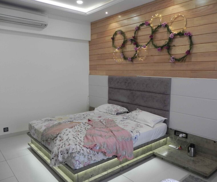 Luxury bedroom design with accent headboard and wooden backdrop