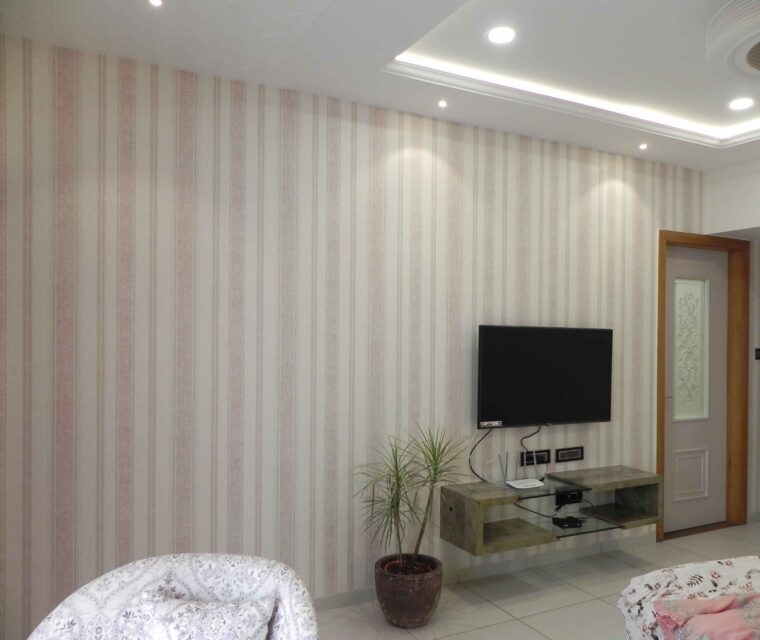 Bedroom TV wall design with minimalist floating cabinet and planter