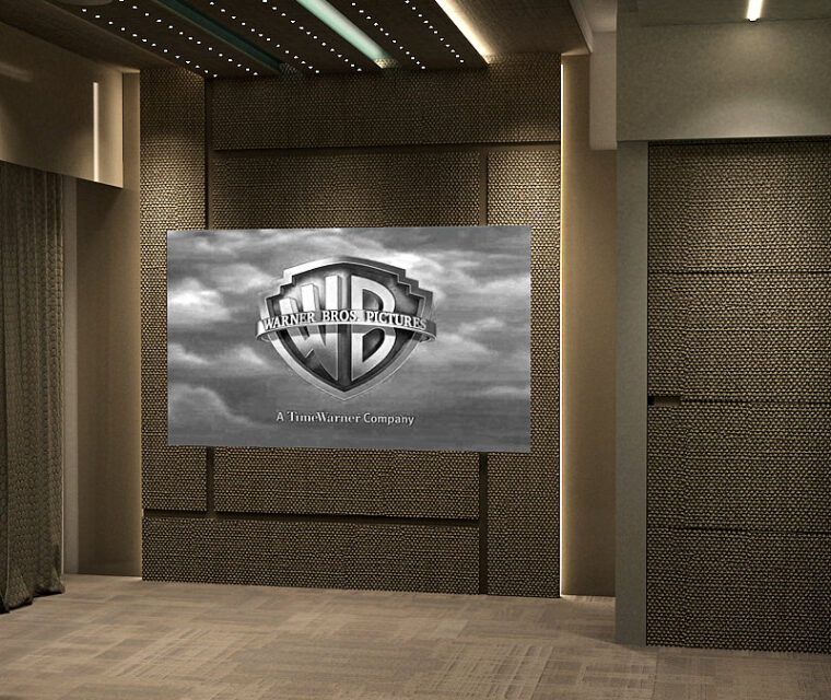 Home theater wall with acoustic panels and projector screen