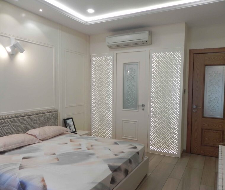 Bedroom interior styling with classic paneling and headboard design