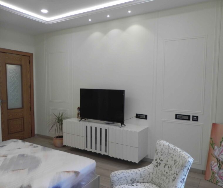 Contemporary bedroom TV unit and accent wall interior decoration