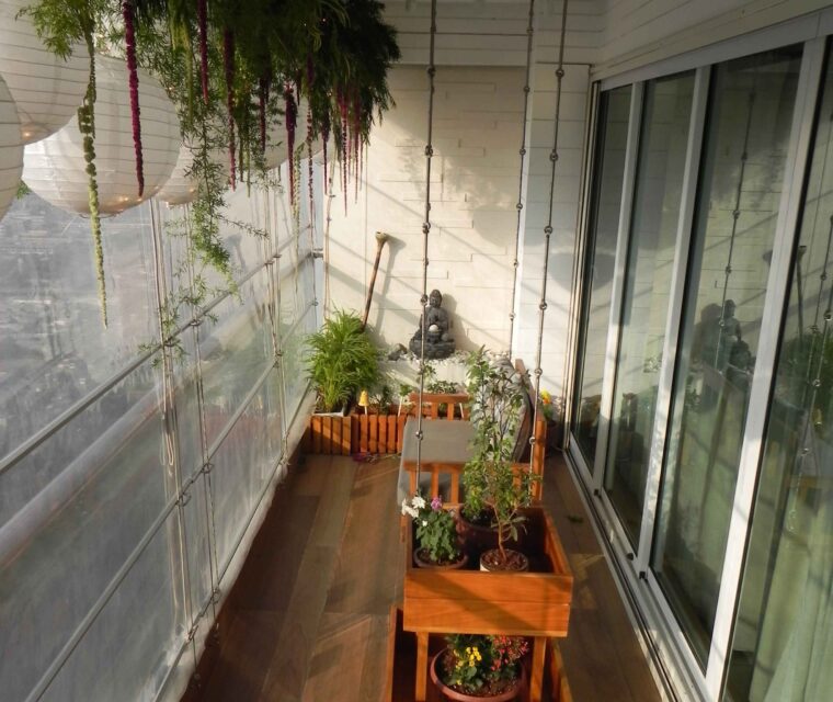 Green balcony garden with hanging plants, serene apartment patio design