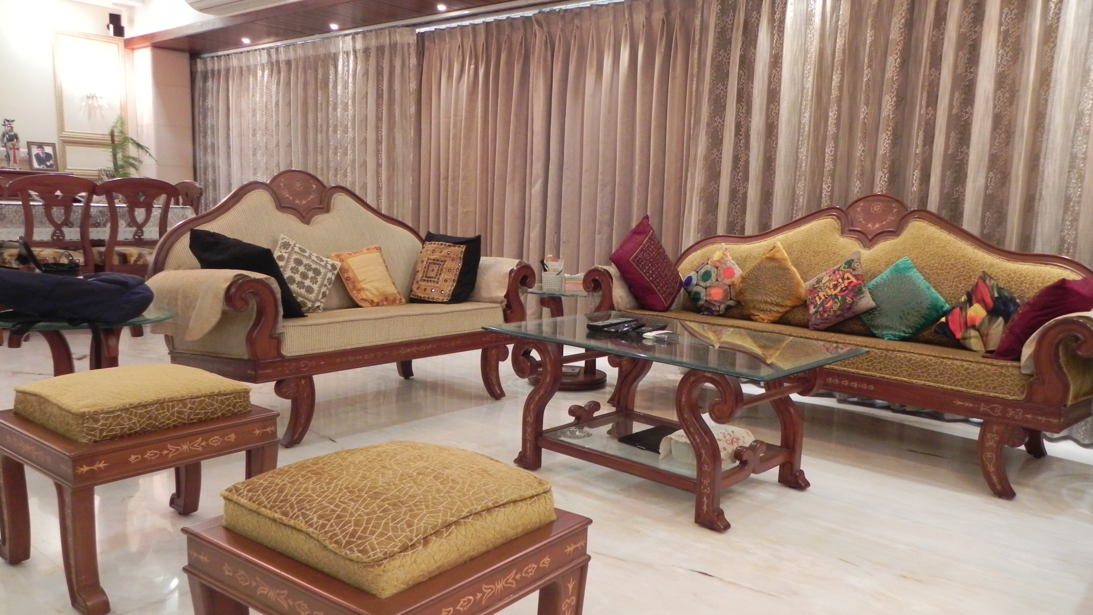 Contemporary kitchen with modular storage, black countertop, and abstract wall tiles
