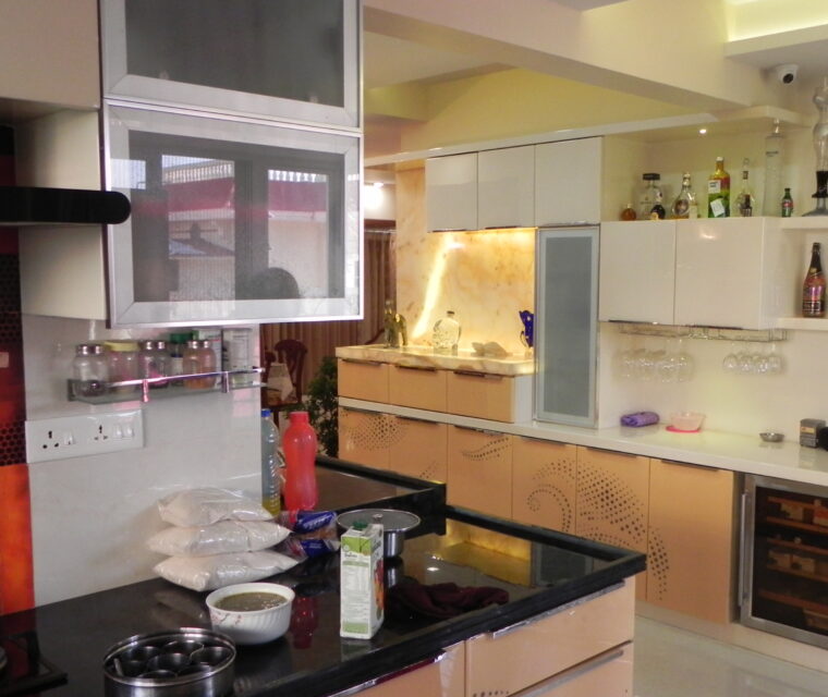 Kids bedroom with simple bed, blue floral bedding, and natural lighting