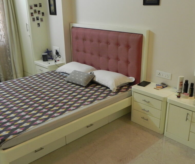 Designer modular kitchen with wine fridge, storage cabinets, and modern fittings