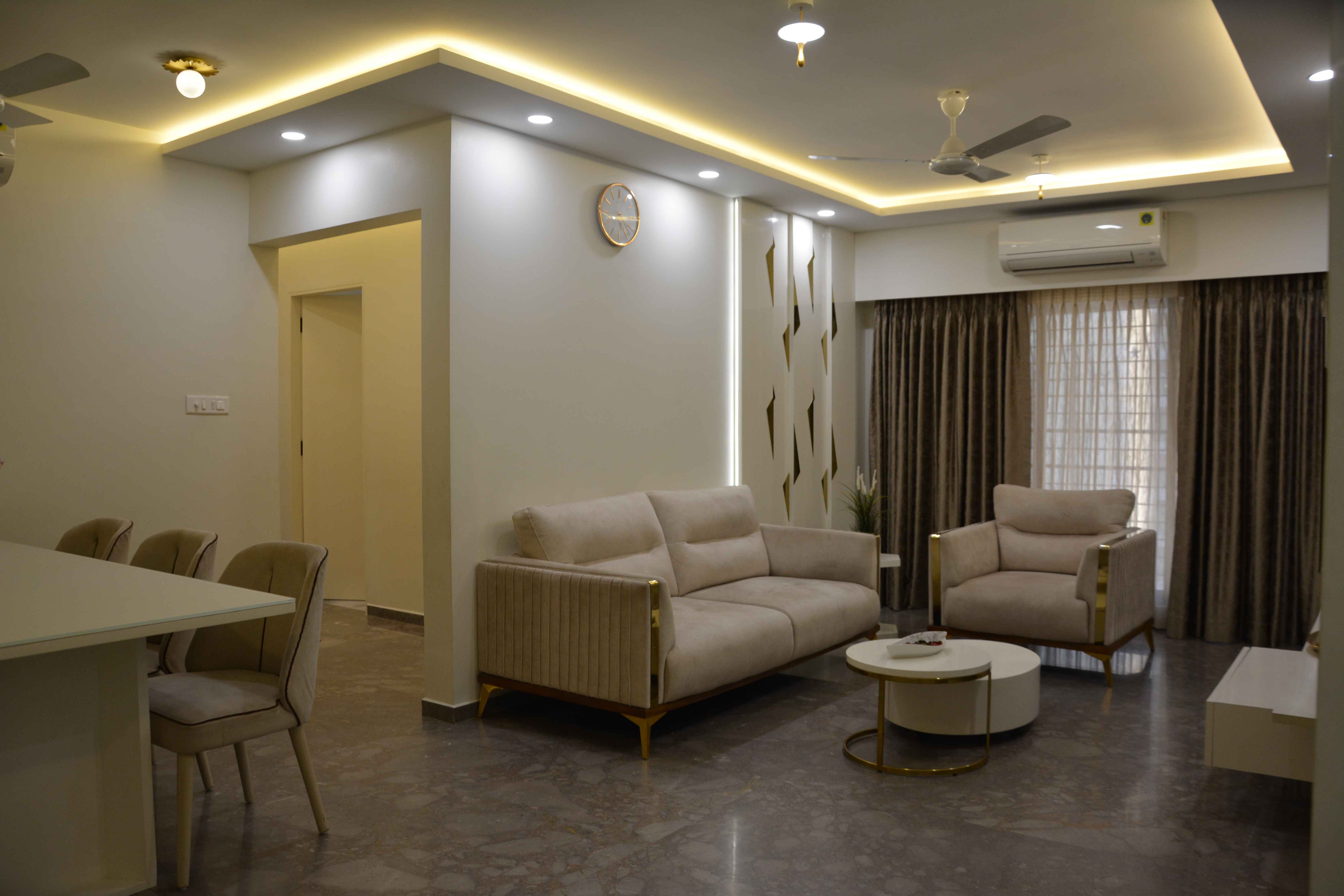 Luxurious living room with plush sofas, accent tables, and LED lighting design