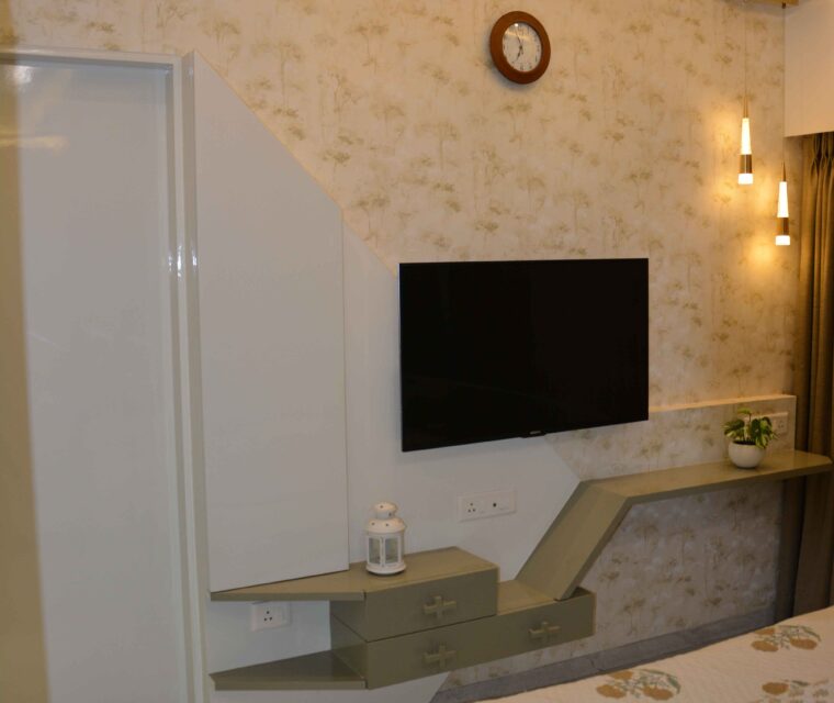 Modern bedroom TV unit with designer shelves and warm lighting interior design