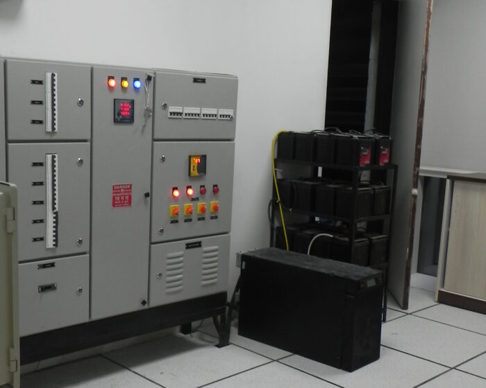Industrial workspace server room interior with air conditioning and electrical control panels