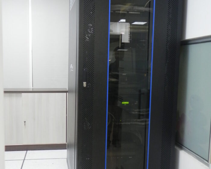 Secure server rack area interior with network equipment in a corporate IT room