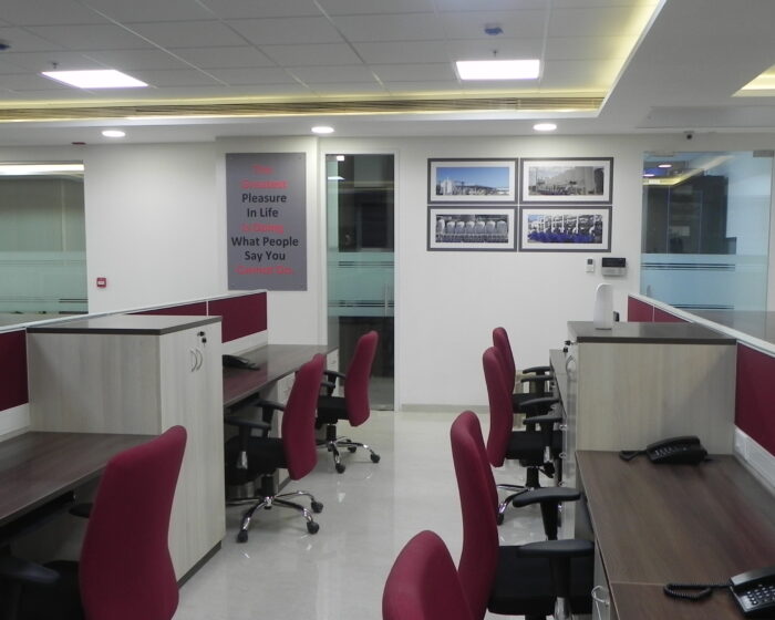 Contemporary open office layout with collaborative workstations and telephones for productivity