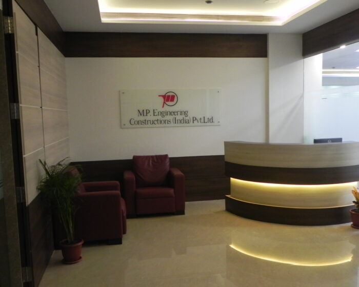 Stylish reception area interior at M.P. Engineering office with branded logo and designer lighting