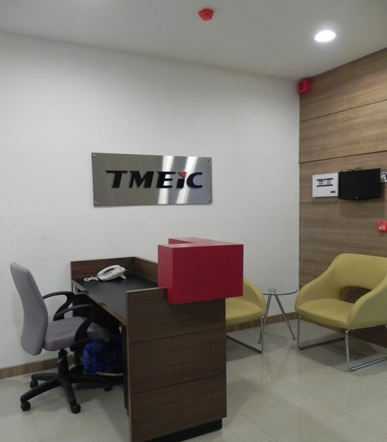 Modern reception area interior design for corporate office featuring ergonomic seating and branded signage