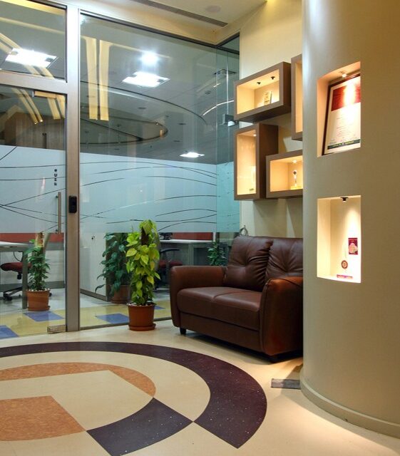 Modern executive office with elegant wooden furniture, leather chair, and contemporary decor – premium workplace interior design